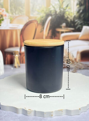 El cuerpo de vidrio posee un recubrimiento negro mate profundo que oculta el contenido, ofreciendo una estética limpia y sofisticada.